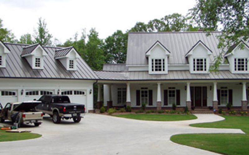 Residential home with metal roofing and gutters.